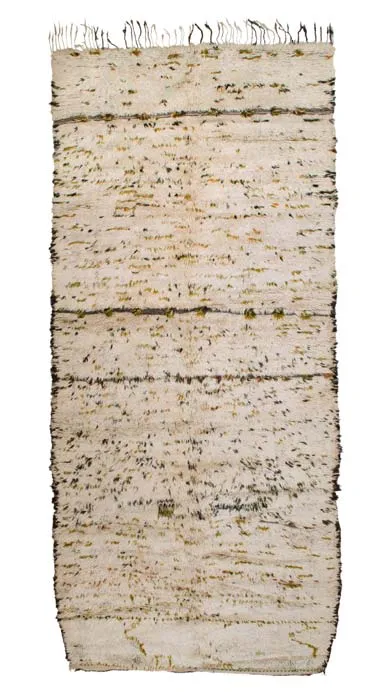 Ivory Azilal rug with scattered dark and green marks