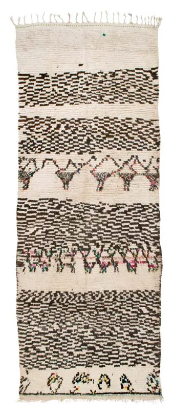 Narrow ivory rug with black zigzags, diamonds and small coloured motifs