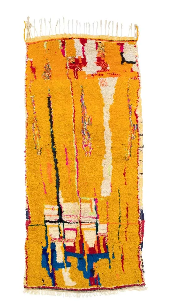 Yellow-orange rug with a strong central arrangement of coloured lines