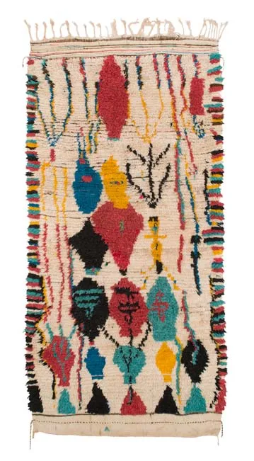 Ivory rug with bright diamond medallions and plant-like motifs