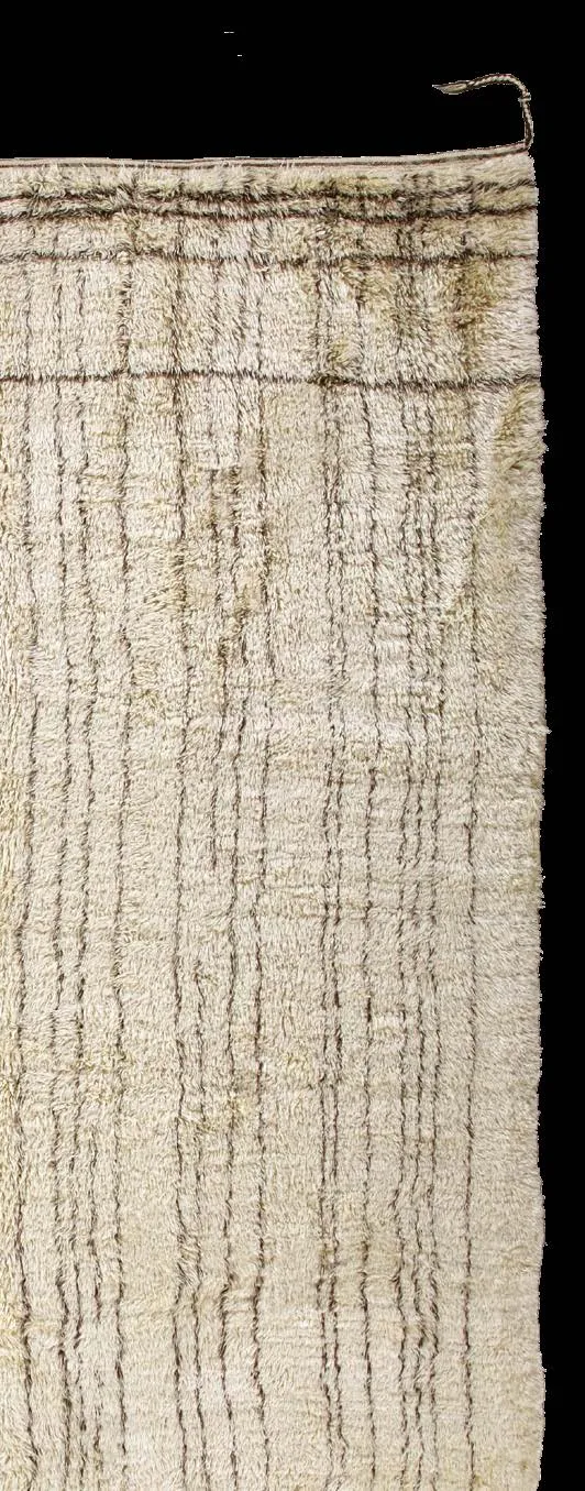 Long white pile rug with sparse dark lines and diamond forms