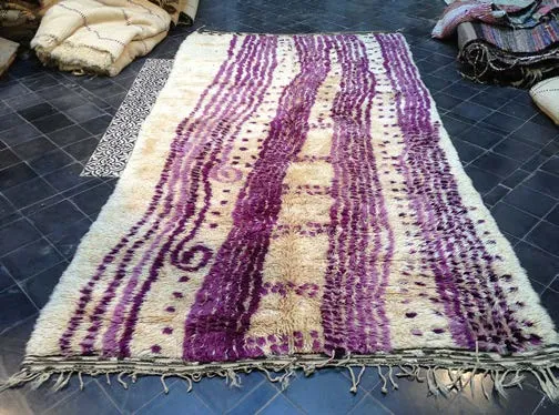 Purple-and-white striped rug displayed on a tiled floor