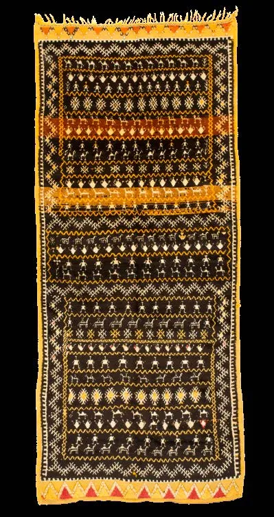 Dark rug framed by many narrow geometric borders