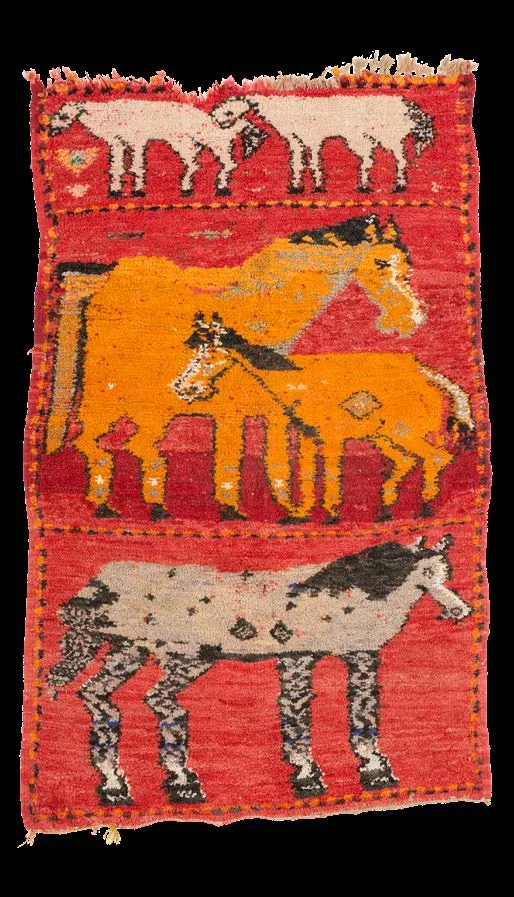 Red and orange rug with three horizontal registers of stylised animals