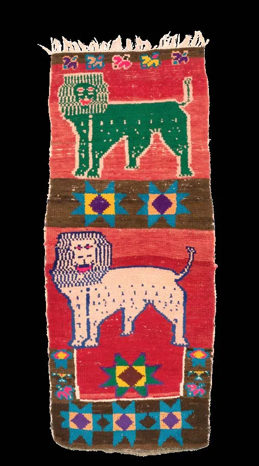 Red pictorial rug centred on a large green lion