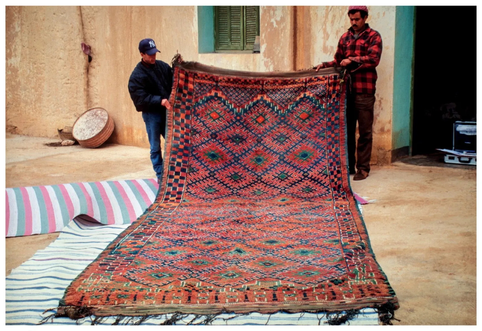 Beni Snassen rug held upright by two people