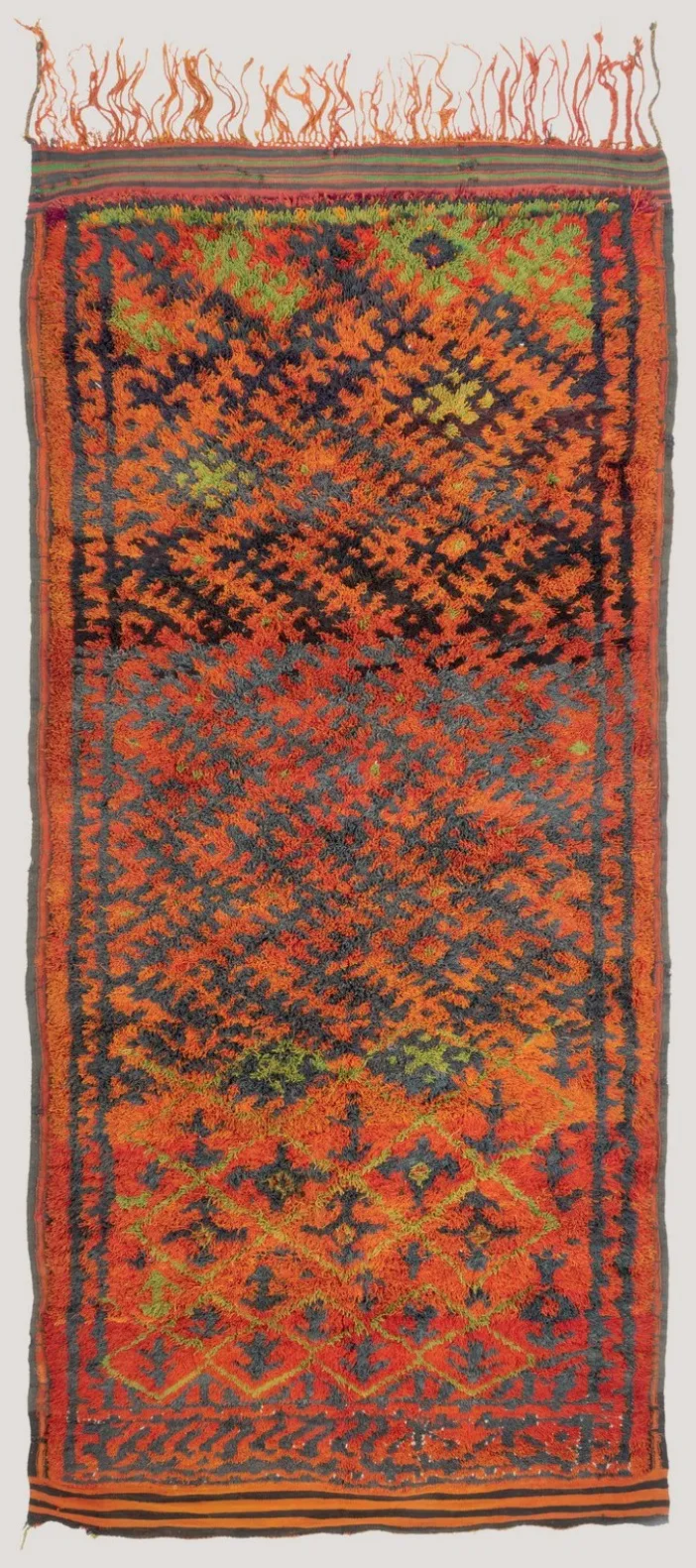 Orange high-pile rug with a dark branching pattern