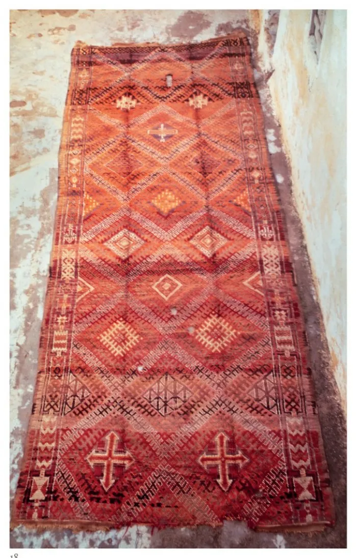 Red Beni Bou Zeggou rug photographed on the ground