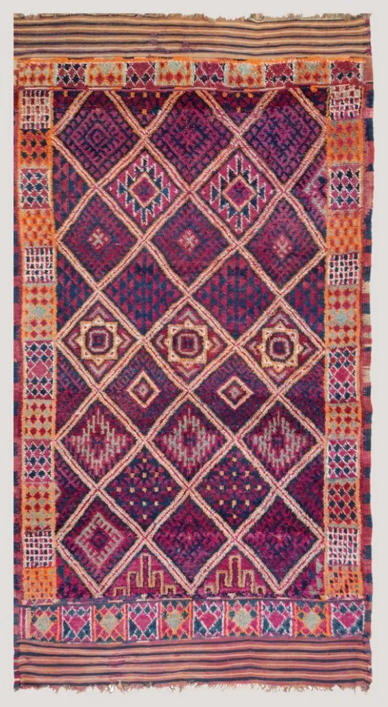 Purple rug fragment with a white diamond lattice