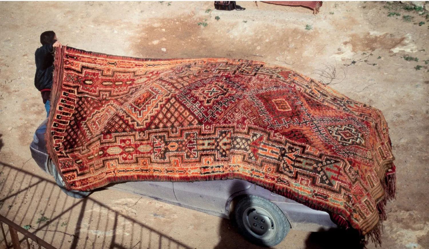 Beni Snassen master-weaver rug spread over a car