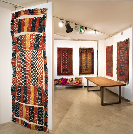 l > r: Uzbek felt rug, antique Baluch rugs from the Walter collection